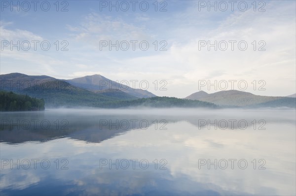 Calm surface of Lake Placid and Whiteface Mountain