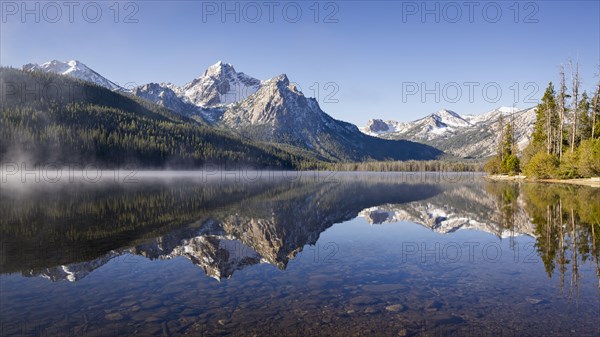 Sawtooth Lake surrounded with snowcapped Sawtooth mountains