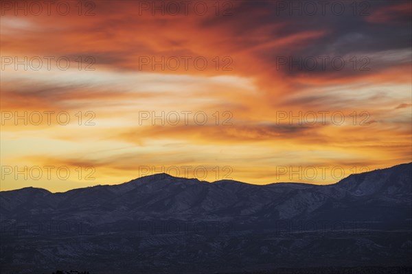 Colorful sunset sky over Galisteo Basin Preserve landscape