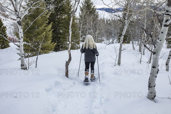 Senior woman snowshoeing