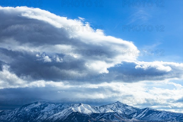 Clouds over mountain landscape