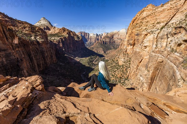 Senior woman at overlook above Zion Canyon in Zion National Park