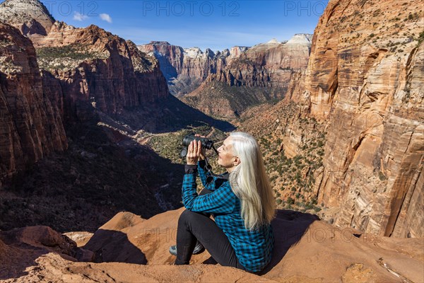 Senior woman at overlook above Zion Canyon in Zion National Park