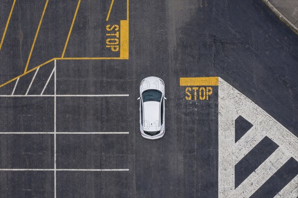 Aerial view of car in parking lot