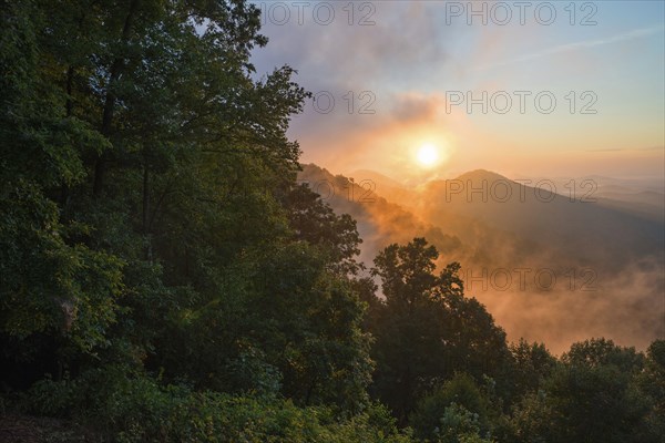 Misty sunrise in mountains