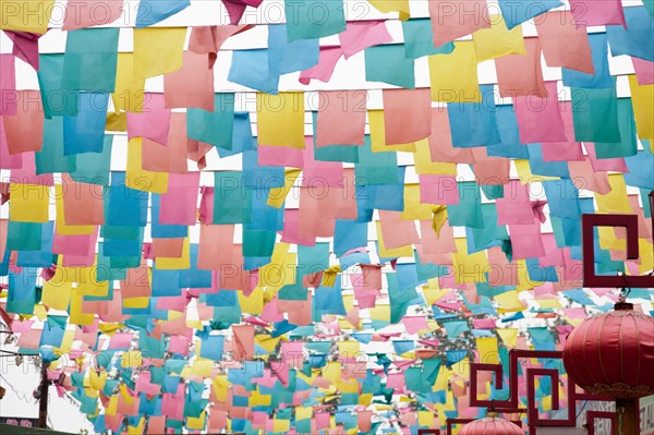 Paper flags over city street