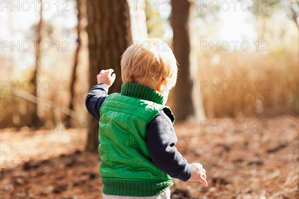 Boy walking in park