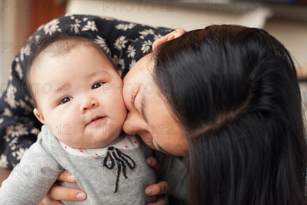 Close up portrait of mother and baby girl