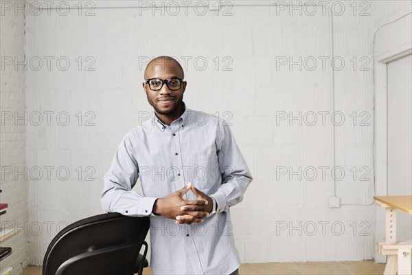 Portrait of young man in design office