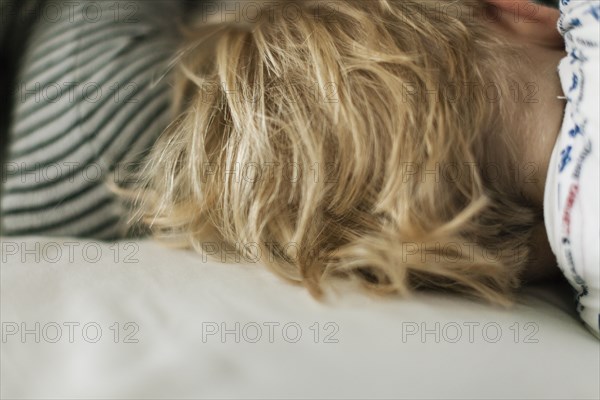 Blonde head of hair of sleeping baby