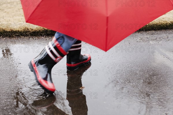 Wellingtons and umbrella