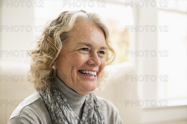 Portrait of happy senior woman at home