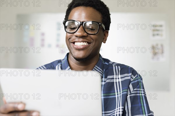 Young man using digital tablet