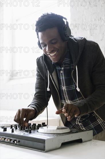 DJ using mixing desk