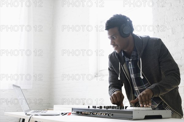 DJ using mixing desk