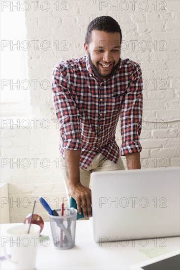 Man with laptop in Small Business