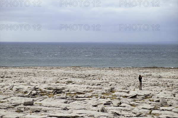 Man on rocky shore