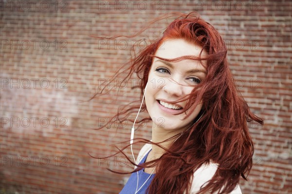 Young woman with long red hair