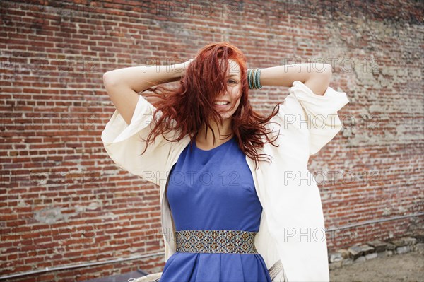 Young woman with long red hair