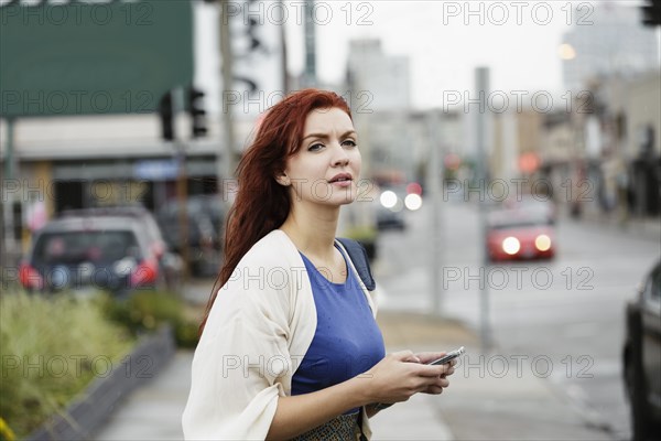 Young woman with long red hair