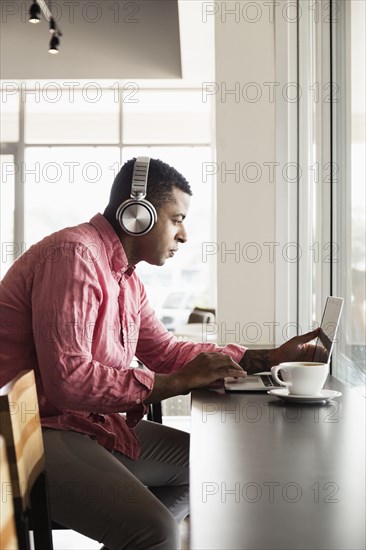 Young man in coffee shop