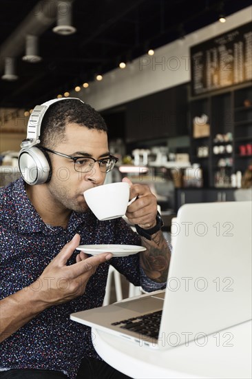 Young man in coffee shop