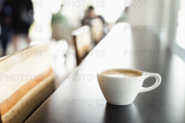 Fresh coffee on counter in coffee shop