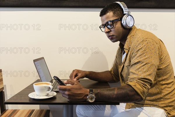 Young man in coffee shop