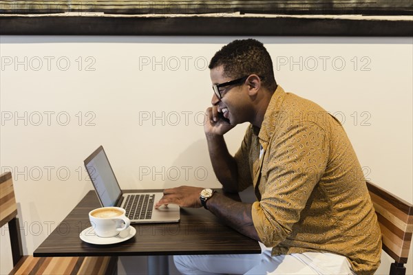 Young man in coffee shop