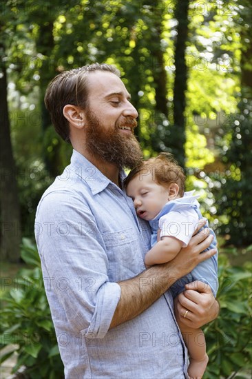 Father holding baby son