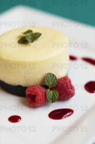 Raspberry cheesecake with fresh raspberries and mint