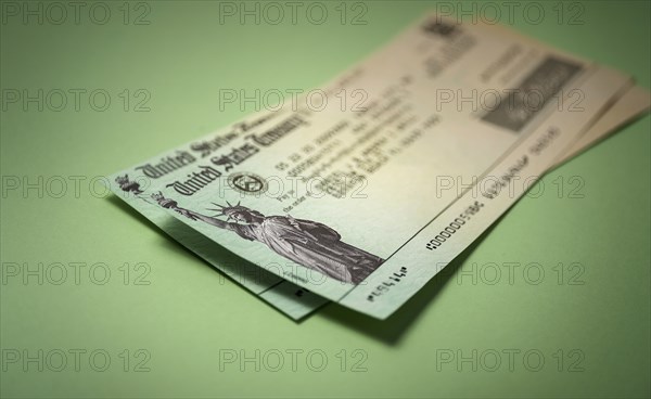 Studio shot of US government check for stimulus money