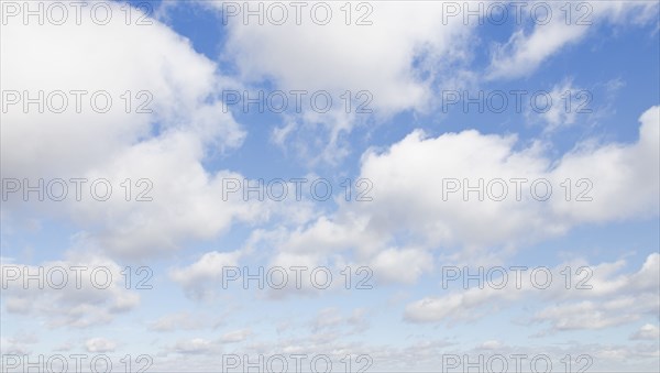 White cumulus clouds on sky