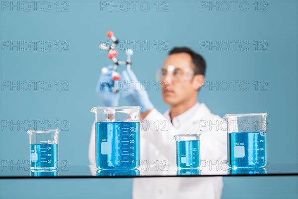 Scientist holding molecule model