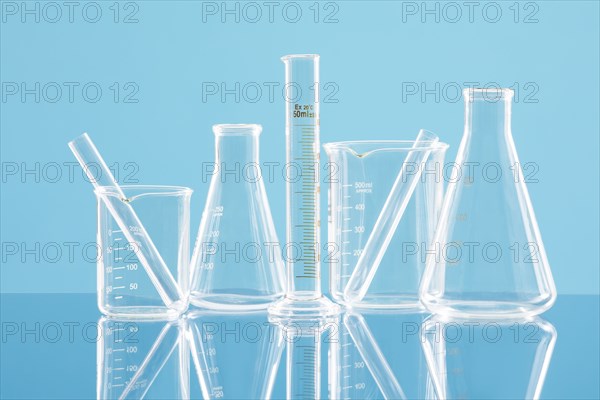 Laboratory glassware against blue background