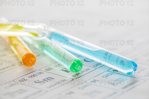 Test tubes with liquids on periodic table