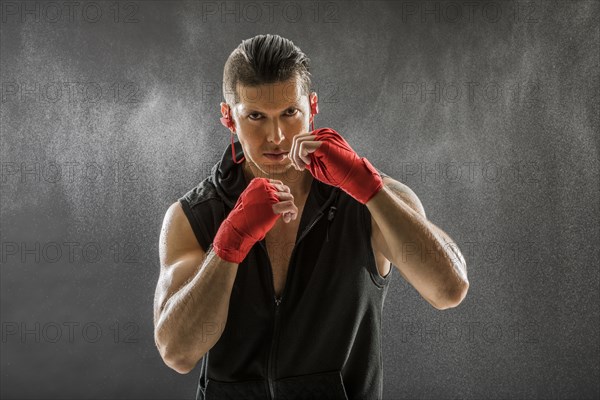 Portrait of muscular man in boxing stance