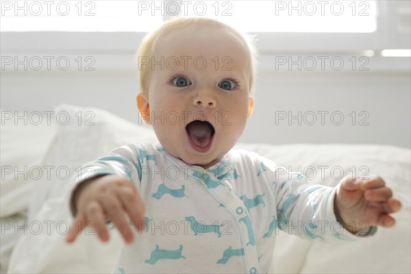 Portrait of baby boy with open mouth