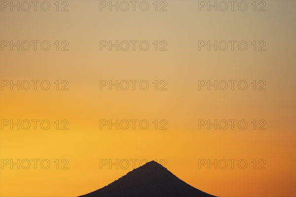 Sunset sky over peak in Cerrillos Hills State Park