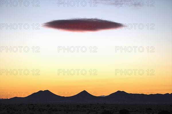 Lenticular cloud over Cerrillos Hills State Park at sunset