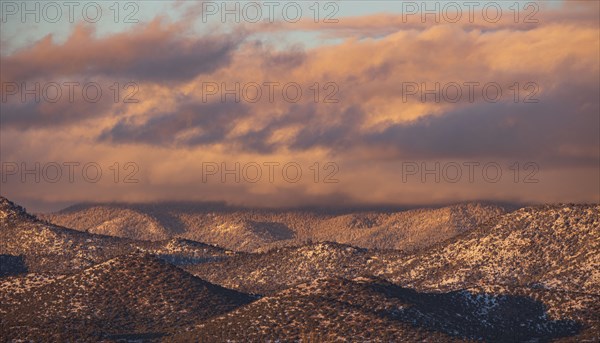 Colorful clouds at sunset over Sangre de Cristo Mountains