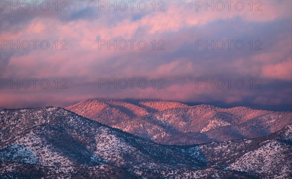 Colorful clouds at sunset over Sangre de Cristo Mountains