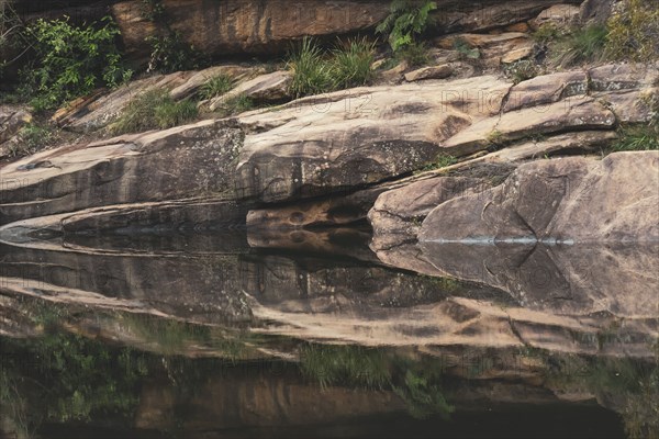 Sandstone rocks reflecting