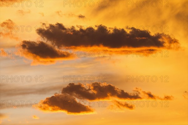 Silhouettes of cloud son sunset sky