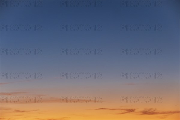 Blue and yellow sunset sky