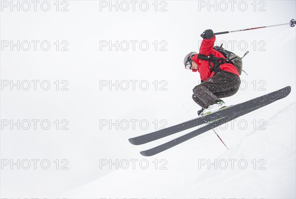 Skier jumping on snowy slope