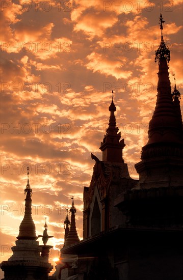 Silhouette of Buddhist temple at sunset