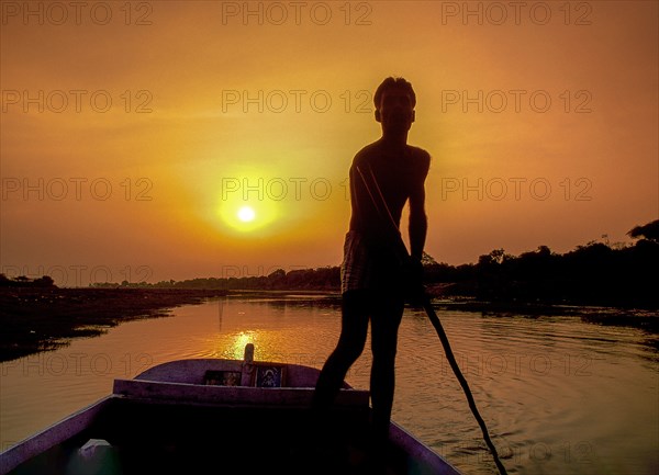 Boatman at sunset