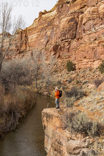 Woman hiking along Escalante River in Grand Staircase-Escalante National Monument