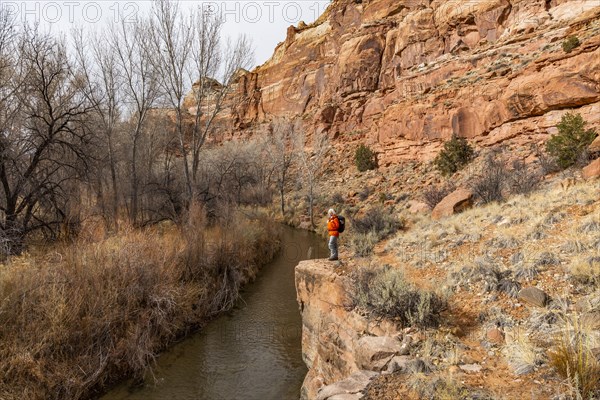 Woman hiking along Escalante River in Grand Staircase-Escalante National Monument